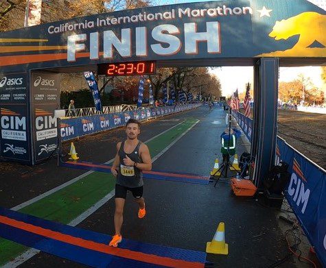 Runner crossing California International Marathon finish line