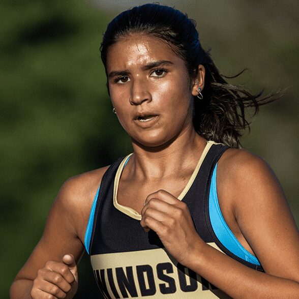 Close-up of female runner in Windsor jersey