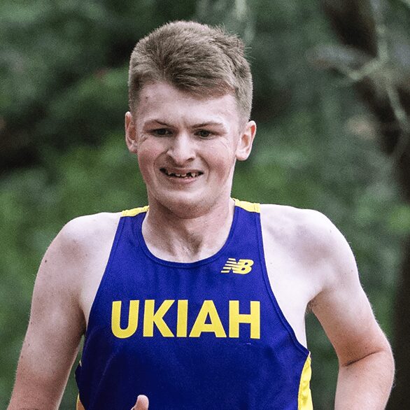 Young runner in blue UKIAH singlet