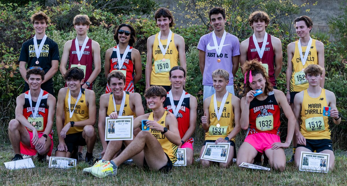 High school cross-country team with medals