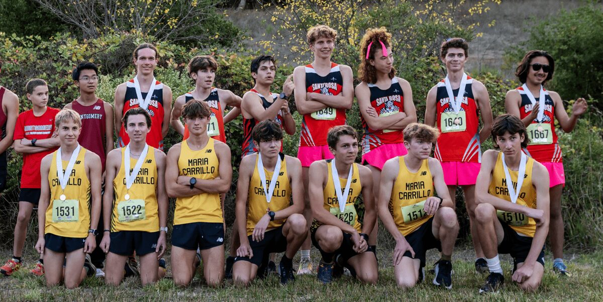 Cross-country teams posing with medals