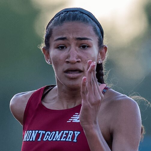 Track athlete in Montgomery jersey sprinting