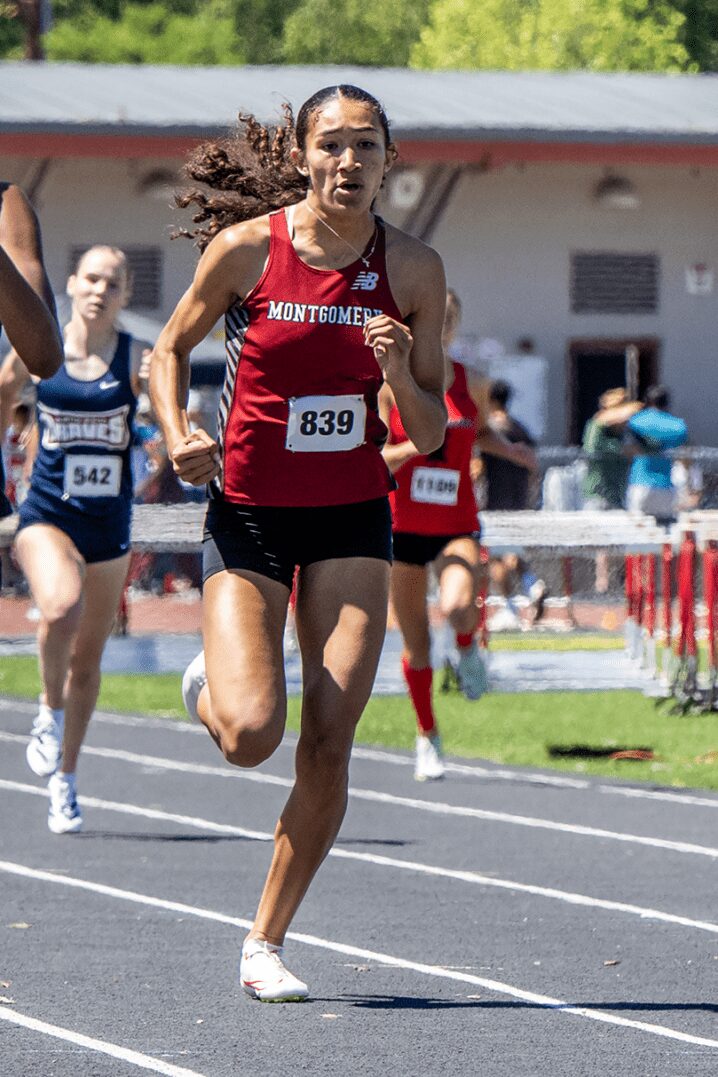 Female sprinter racing on outdoor track