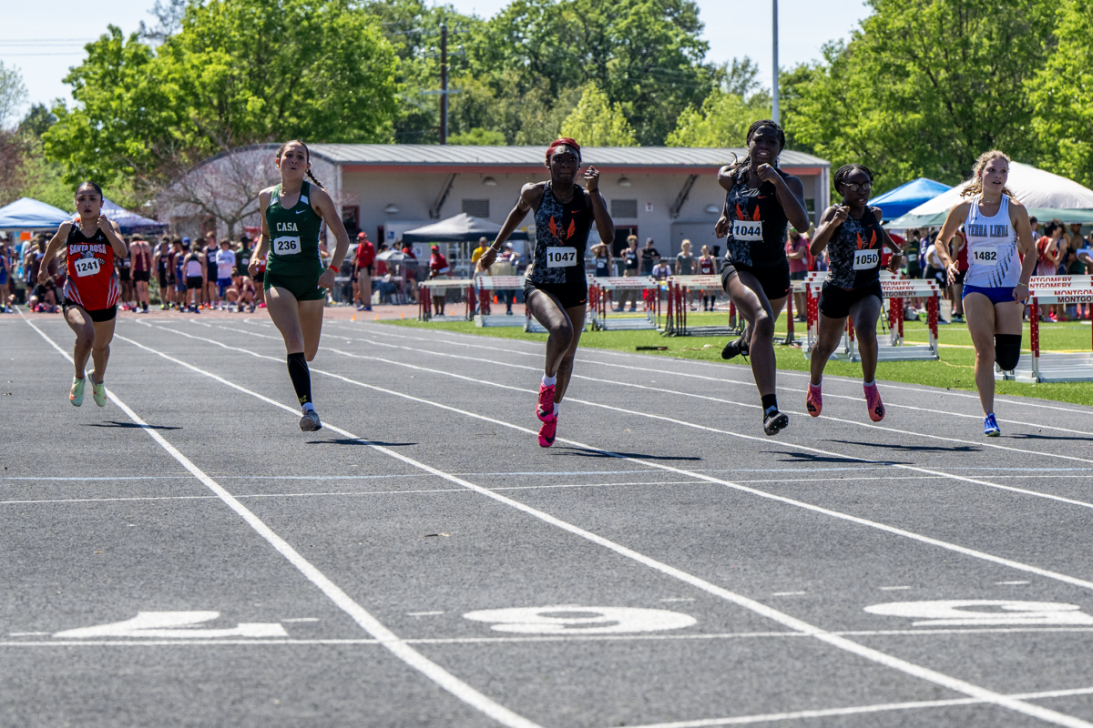 Athletes sprinting in outdoor track race