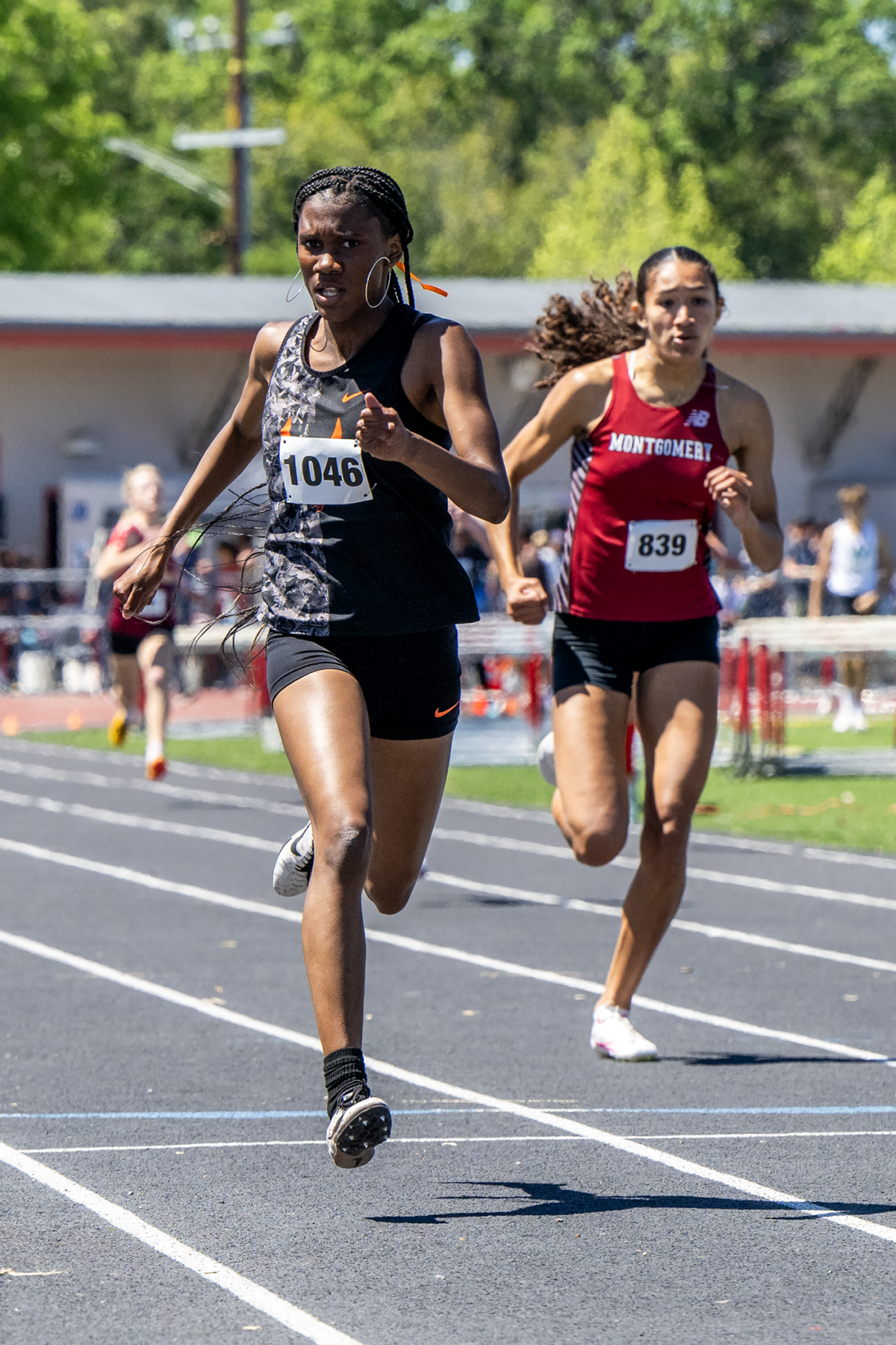 Two sprinters racing on outdoor track