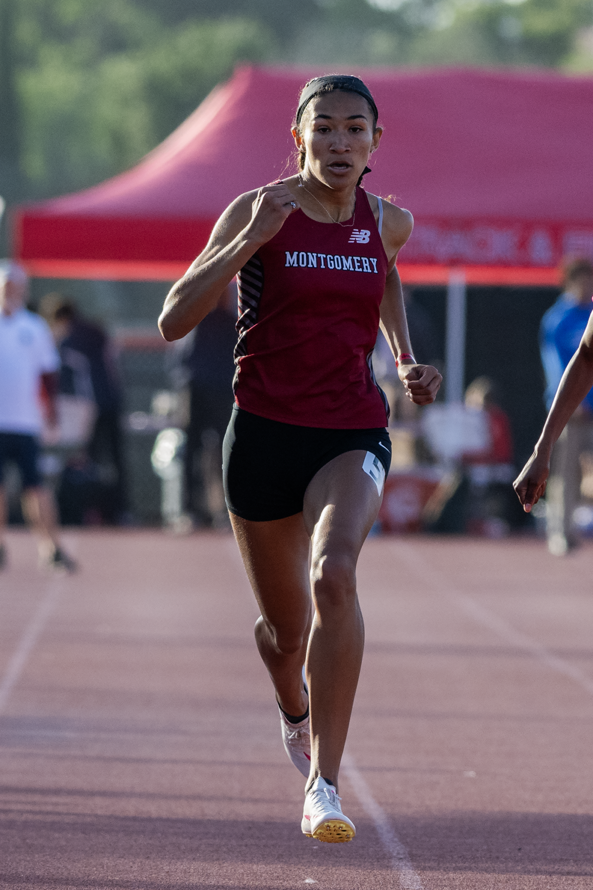 Montgomery athlete sprinting on track