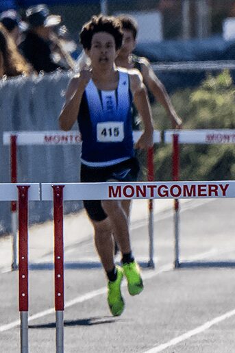 Track athlete hurdling at Montgomery meet