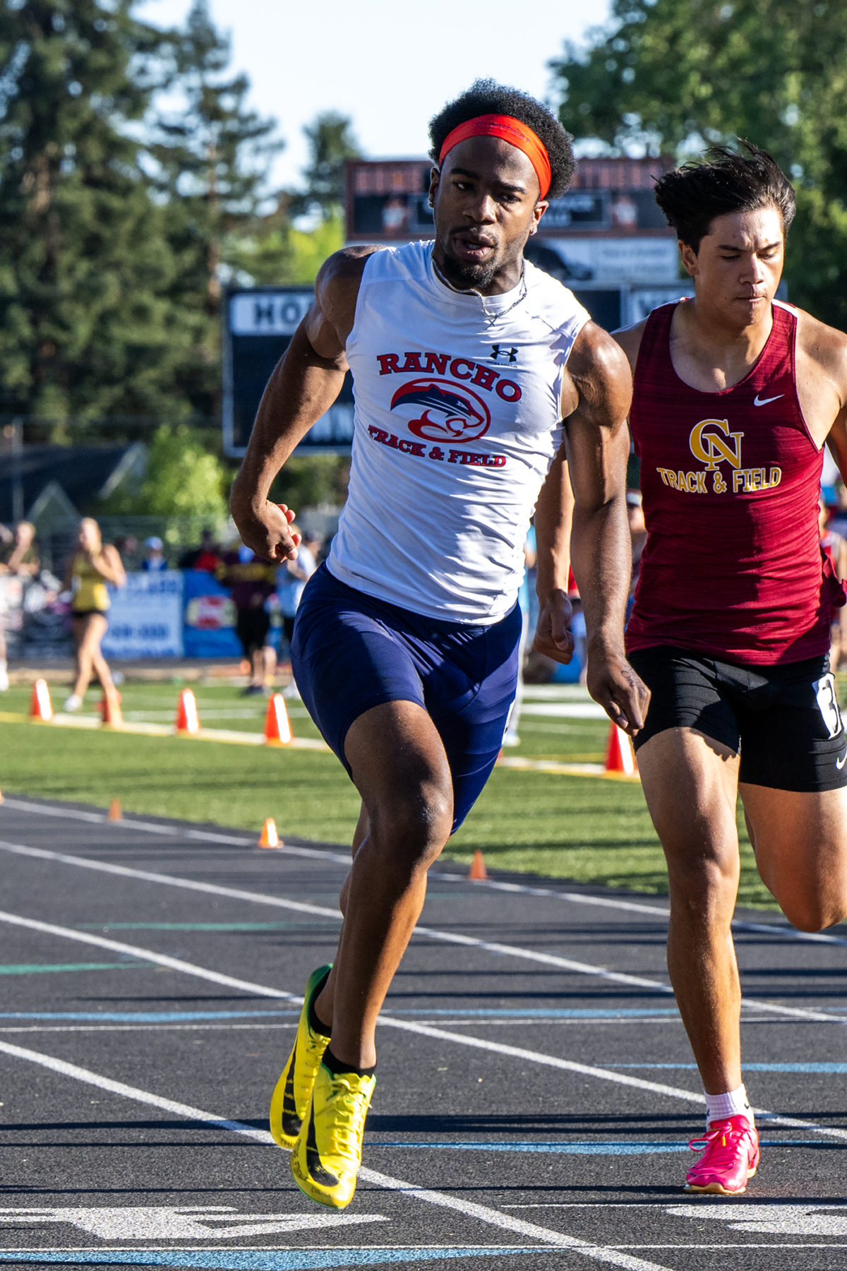 Two athletes racing on an outdoor track