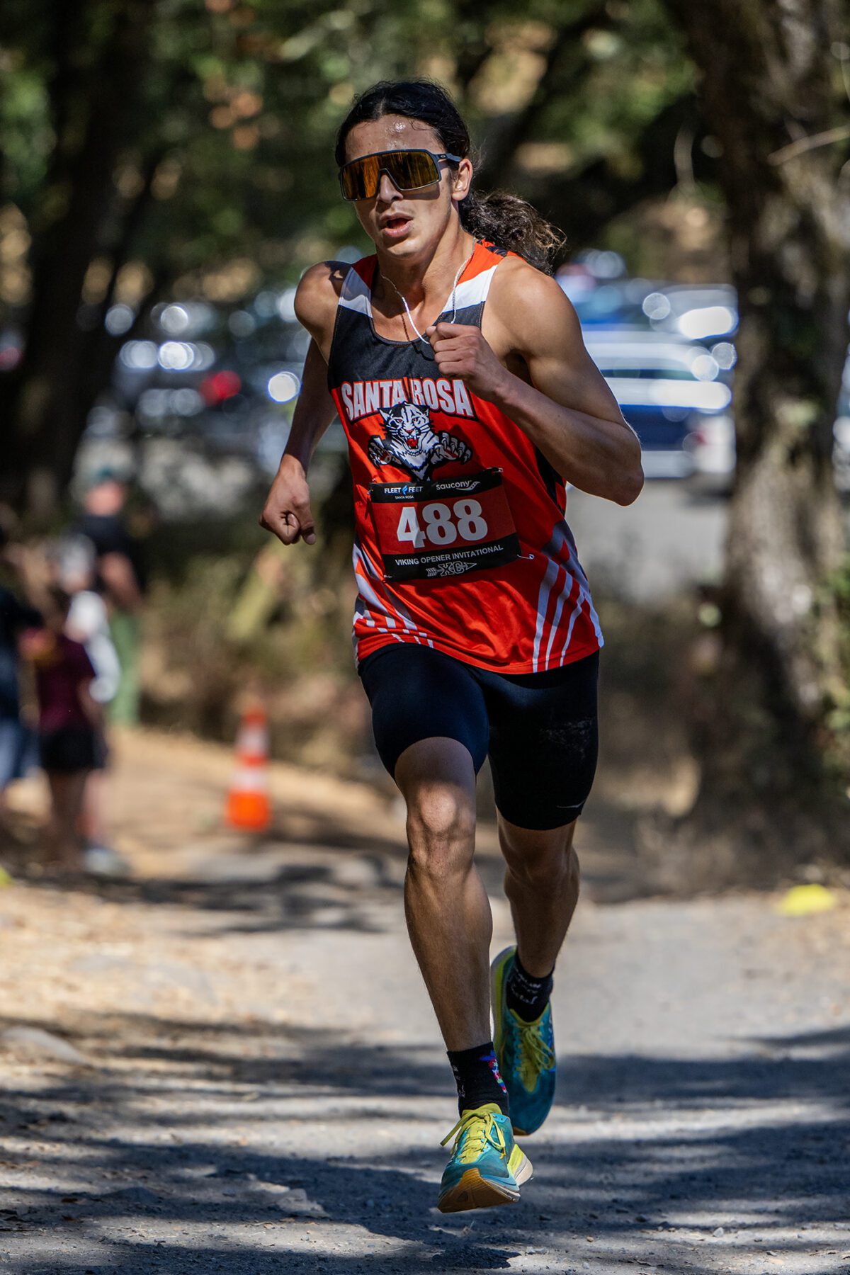 Runner in Santa Rosa red jersey racing outdoors