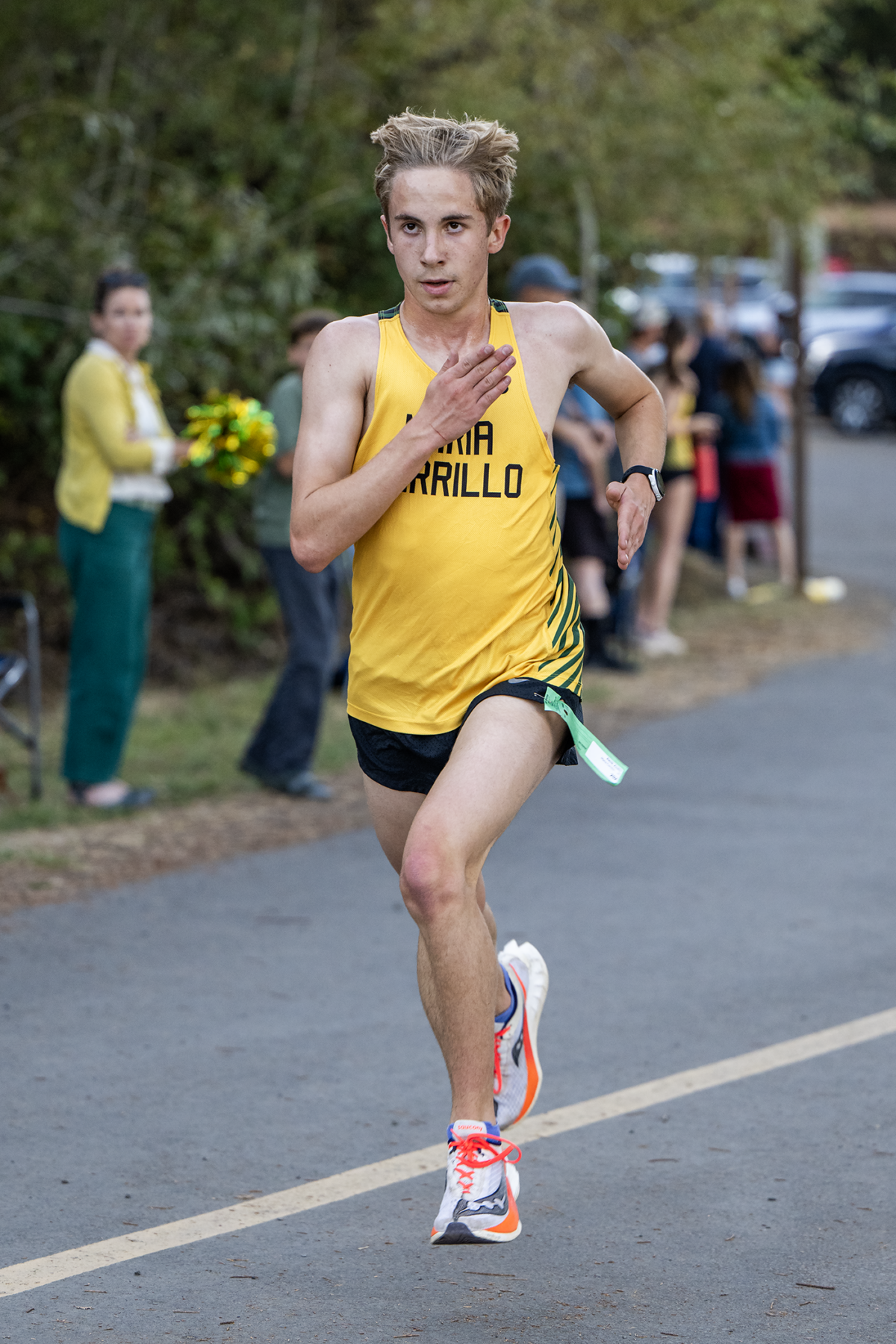 Young runner sprinting on road