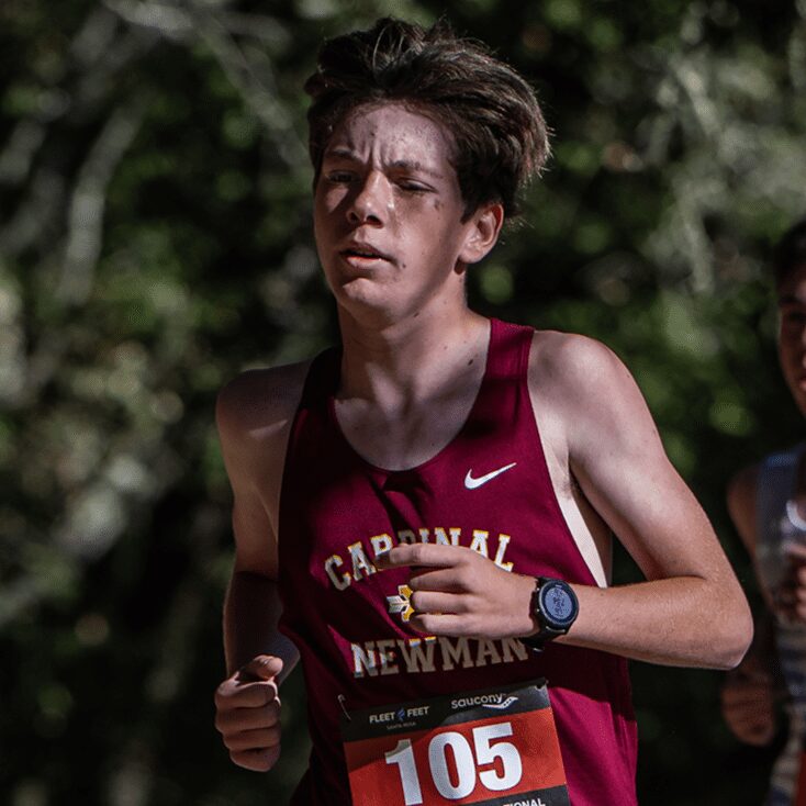 Runner in maroon Cardinal Newman singlet