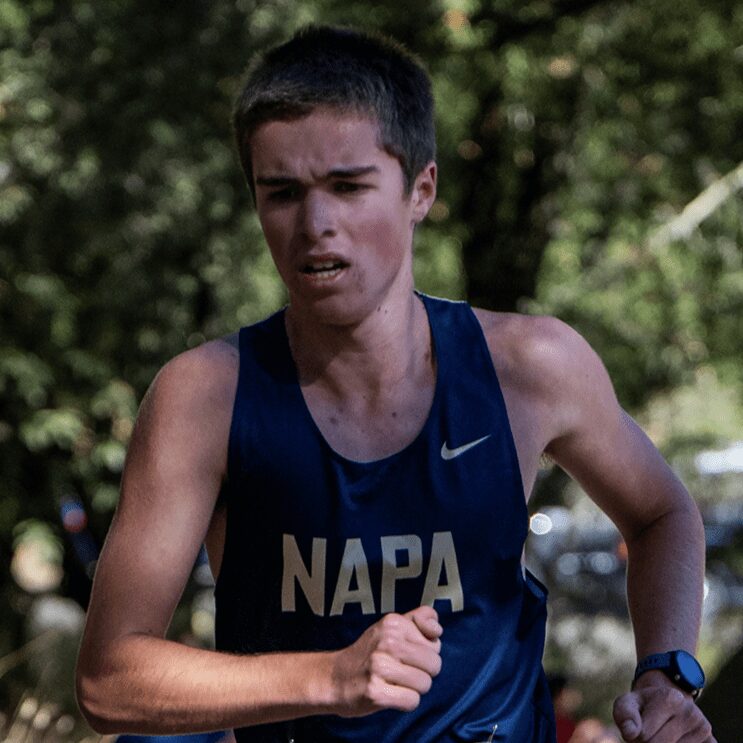 Young athlete running in blue NAPA singlet