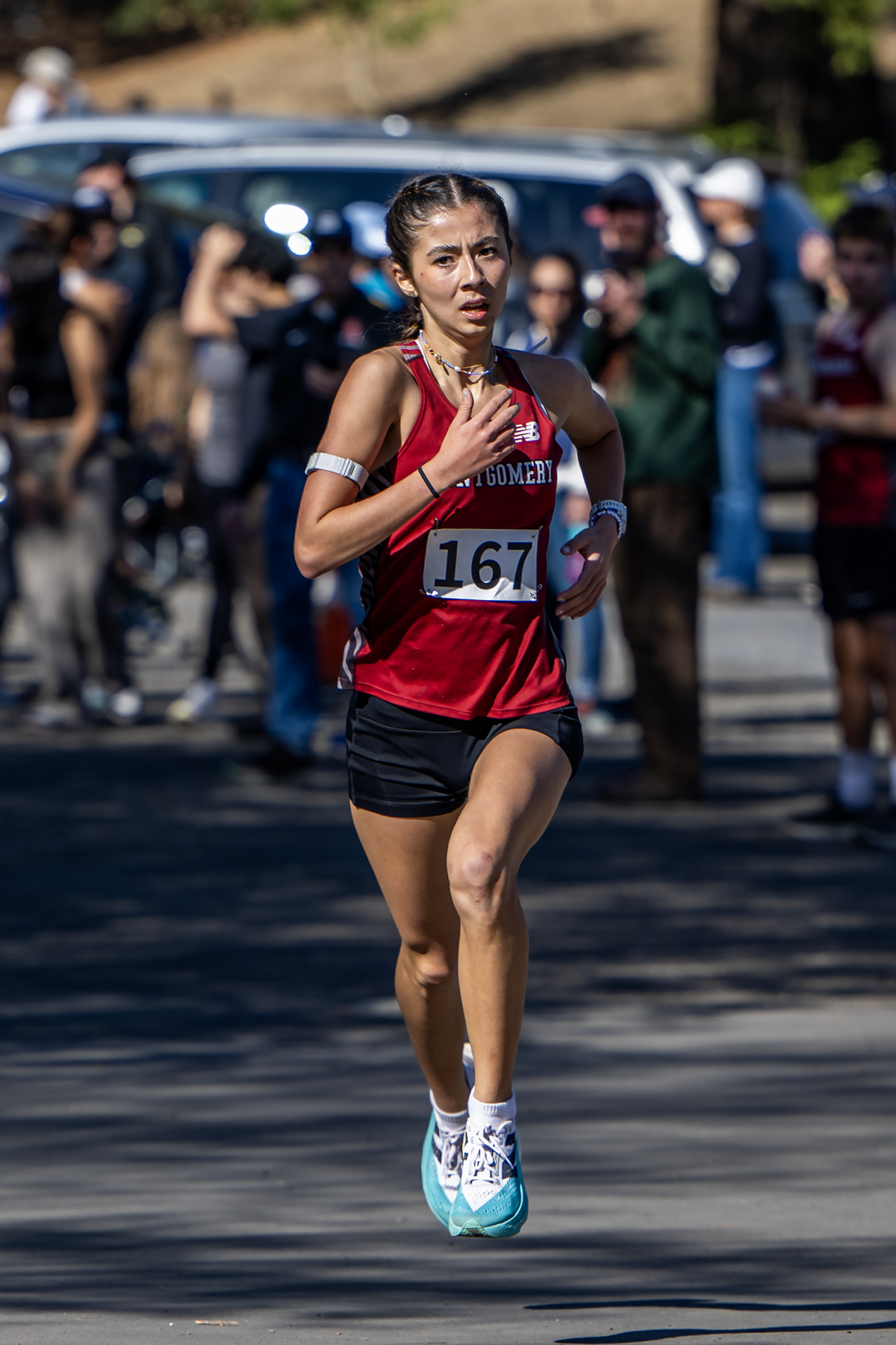 Female runner in red jersey mid-race