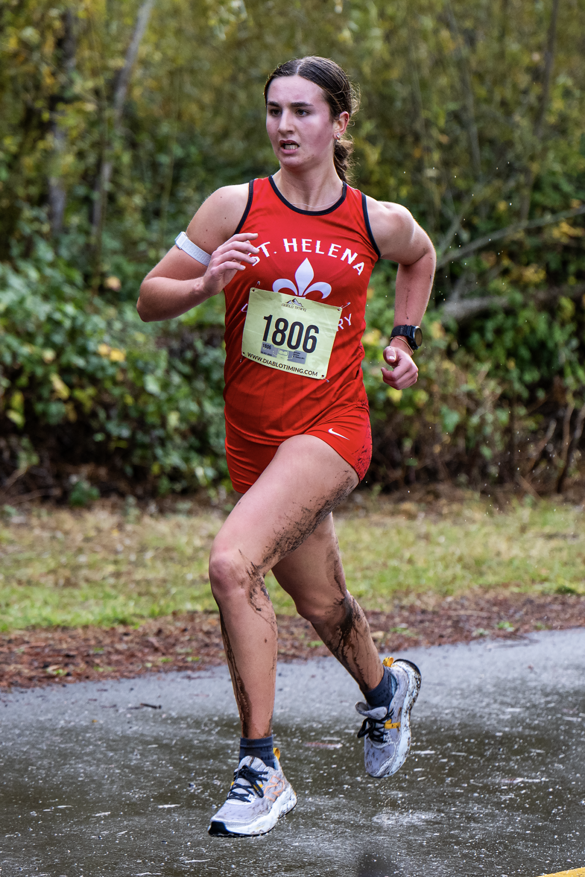 Female cross country runner in red uniform