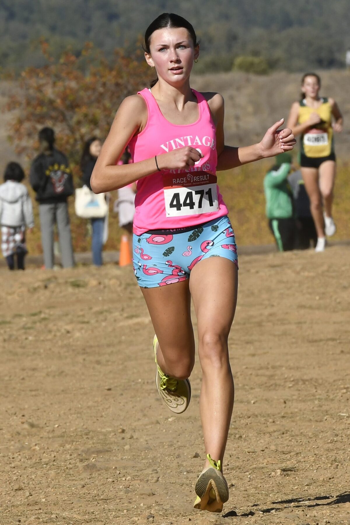 Female runner in pink top, patterned shorts