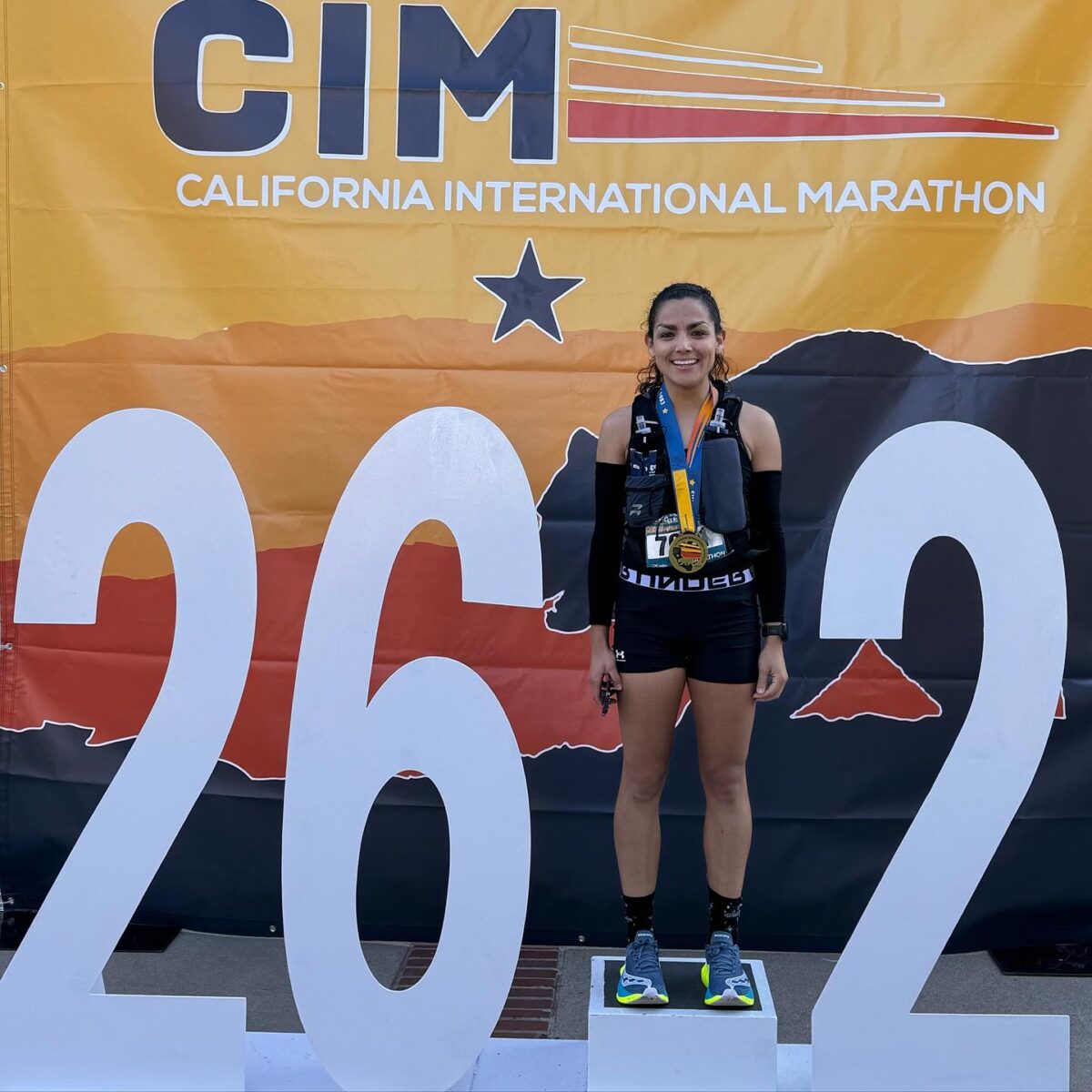 Runner with medal at California International Marathon