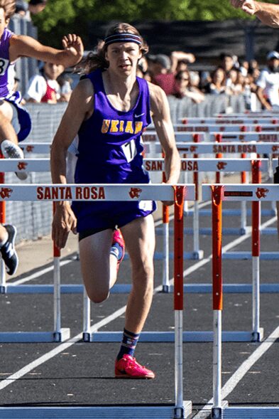 Ukiah hurdler clearing a Santa Rosa hurdle