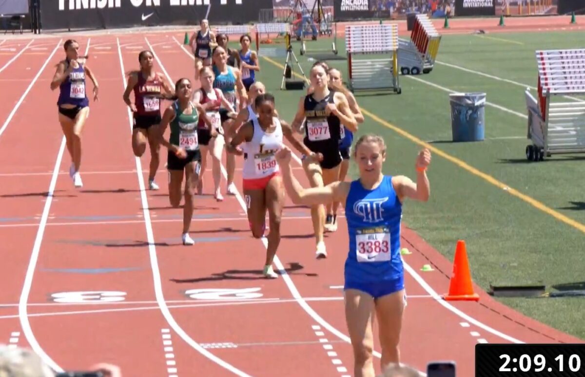 Blue bib 3383 crossing finish with timer