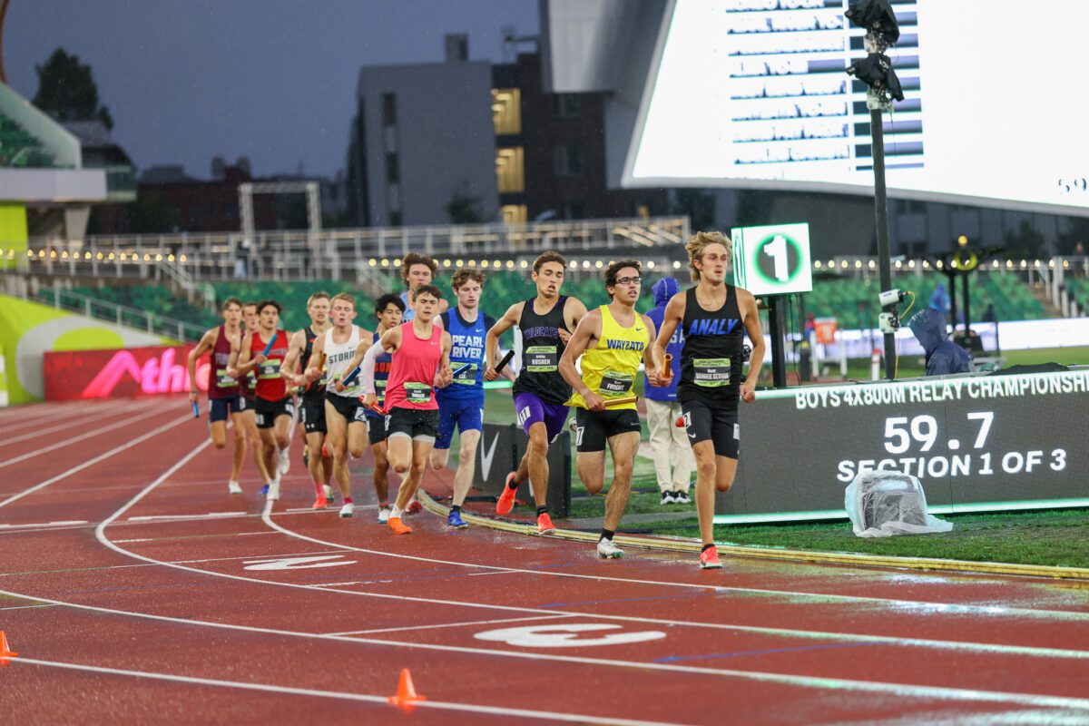Boys competing in middle-distance track race