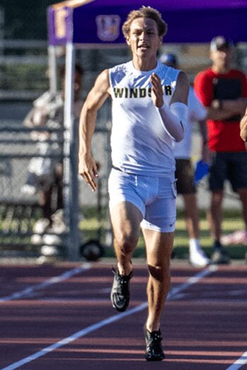 Sprinter in Windsor uniform running on track
