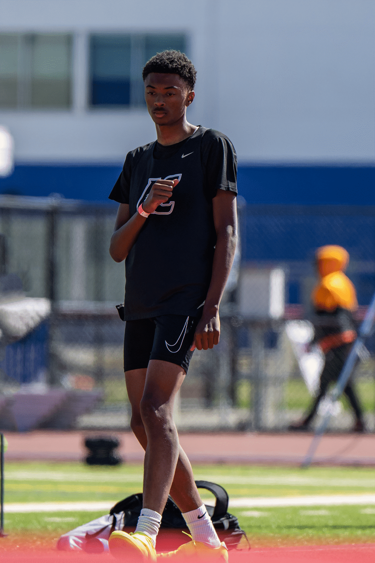 Male track athlete standing on track