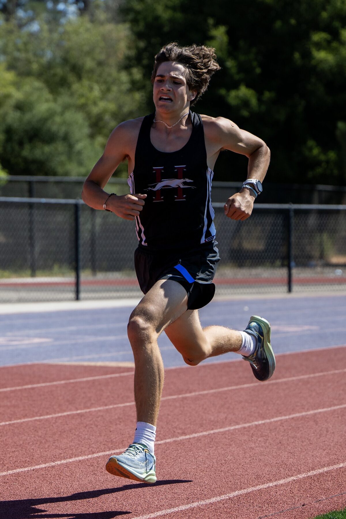 Athlete sprinting on a track during a race.