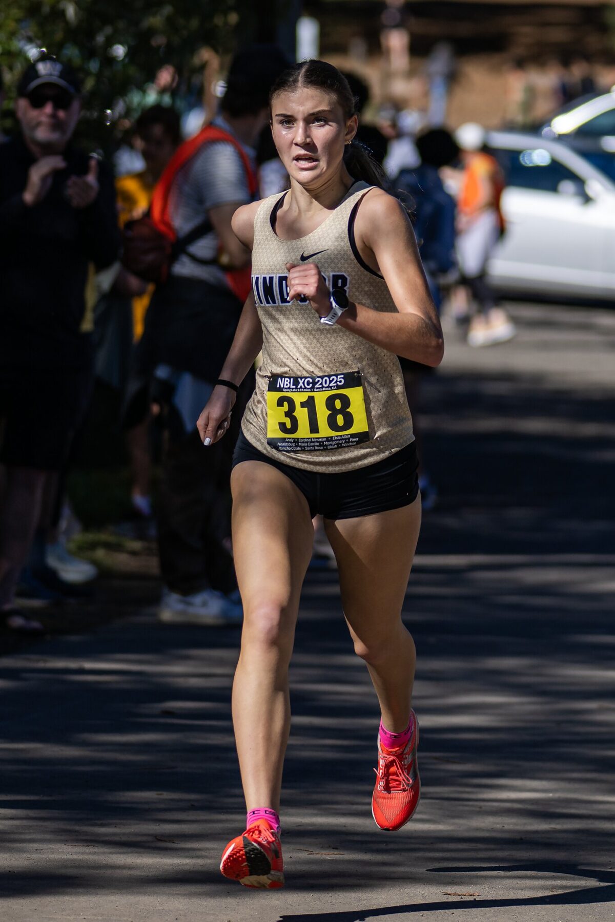 Female runner wearing bib 318 in race