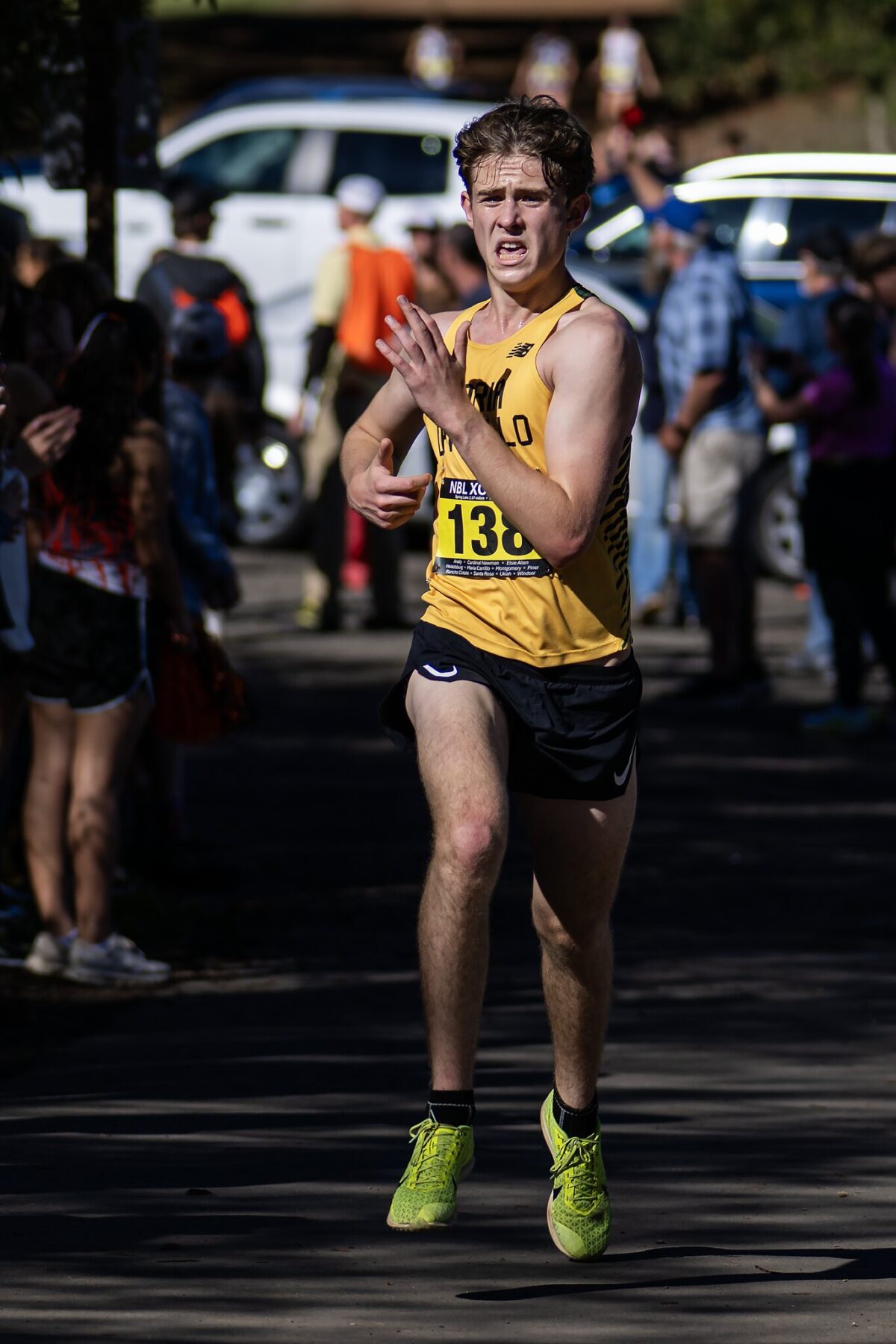 Runner in yellow singlet during road race