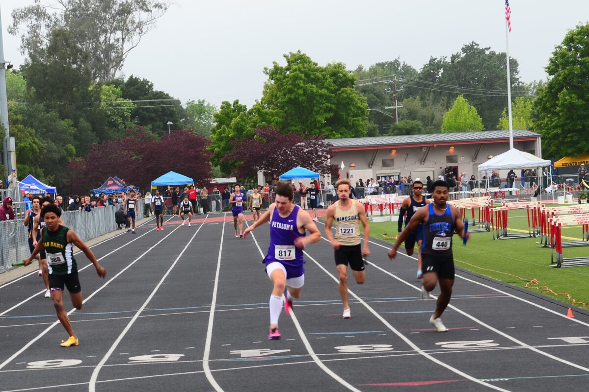 High school sprinters racing on outdoor track