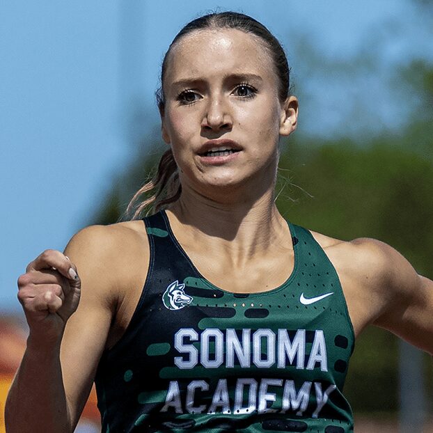 Female athlete sprinting in Sonoma Academy uniform