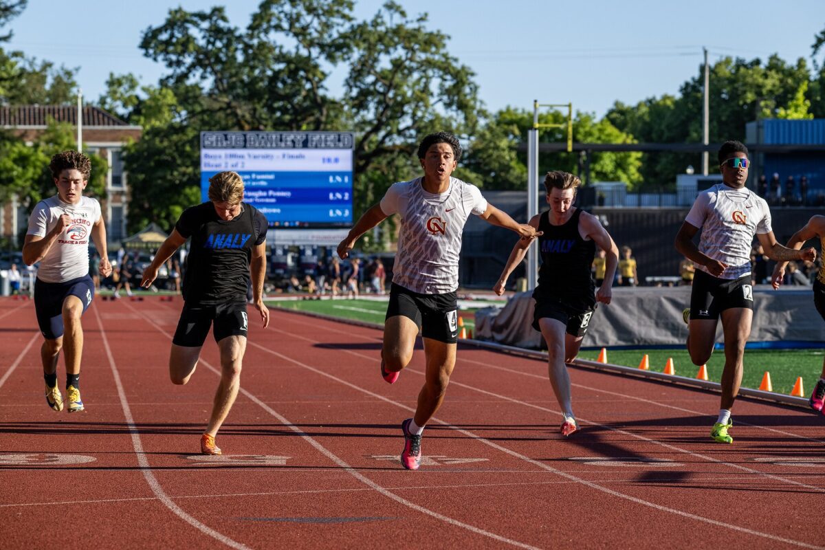 Runners sprinting toward finish line